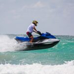 young-man-professional-jet-ski-rider-performs-many-tricks-waves