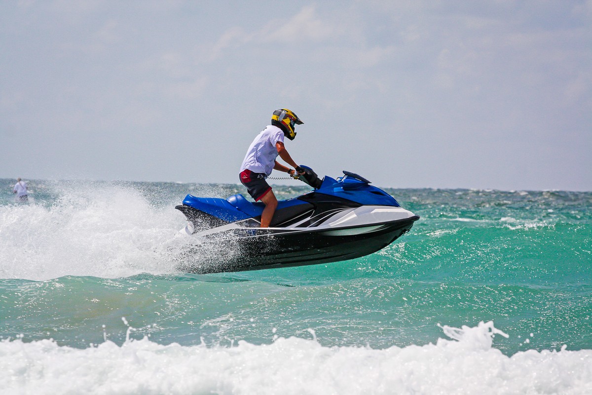 young-man-professional-jet-ski-rider-performs-many-tricks-waves young-man-professional-jet-ski-rider-performs-many-tricks-waves